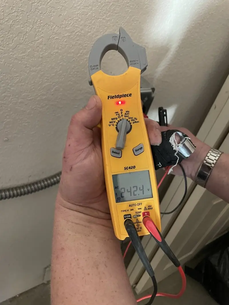Voltage testing with clamp meter during Generator Installation in West Springfield Town